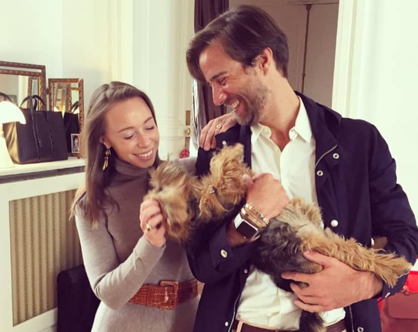 Rickie De Sole with her husband and dog