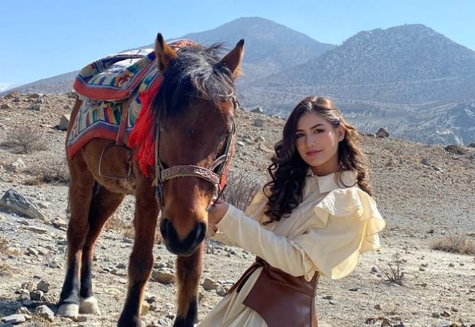   Malika Mahat with a horse