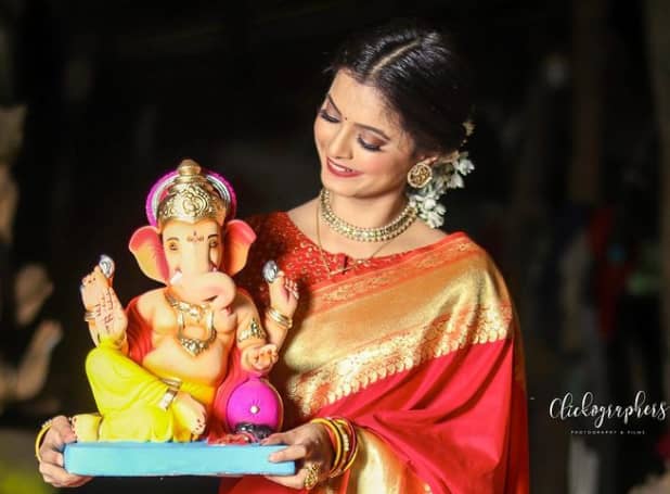 Snehal Lohakare with the lord Ganesh statue