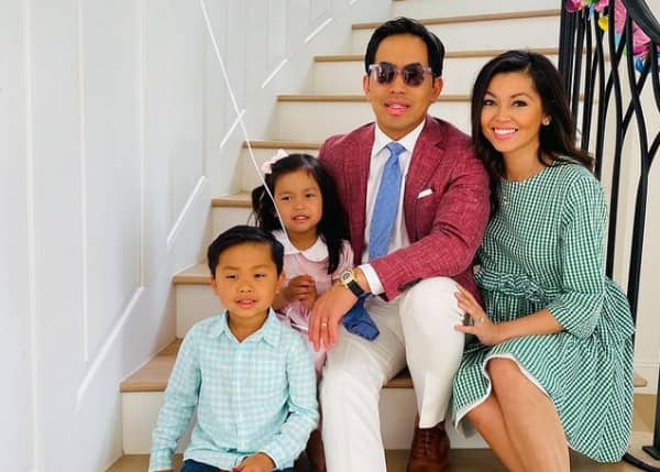 Washington Ho with his wife and kids