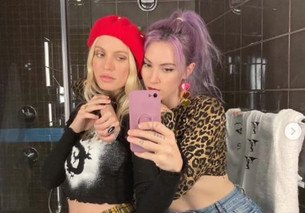 Anabel Englund taking a selfie with fellow musician Camden Cox