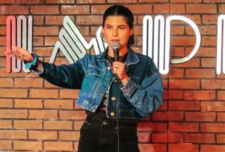 Carly Aquilino performing stand-up comedy