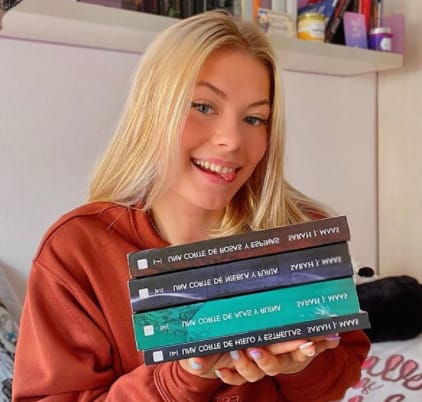 Iryna Zubkova holds books which she has read completely