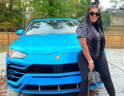 Malinda Panton with her luxurious blue Lamborghini Urus