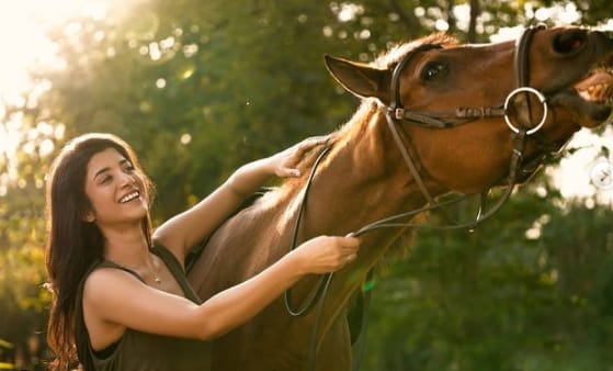 Martina Thariyan with horses