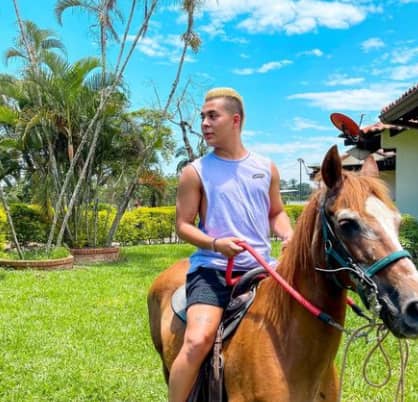 Javier Gomez  is riding a horse