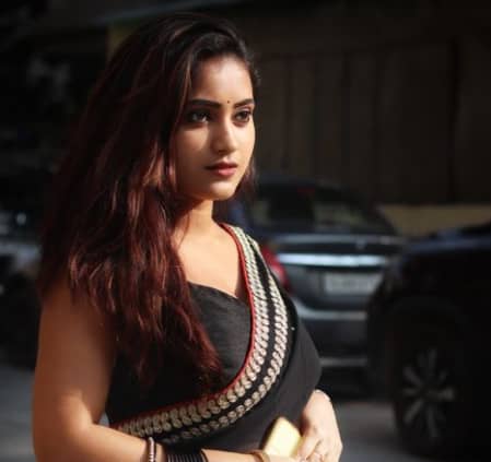 Ankita Mishra in black saree.