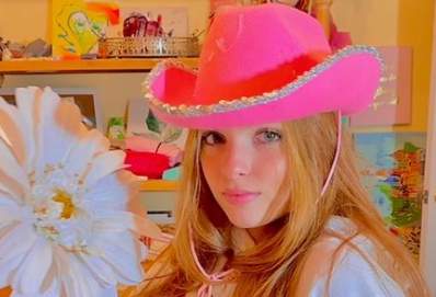 Sofia La Corte wearing a pink hat 