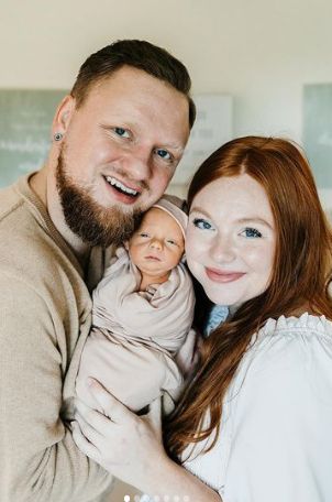 Hannah Cook with her son and husband